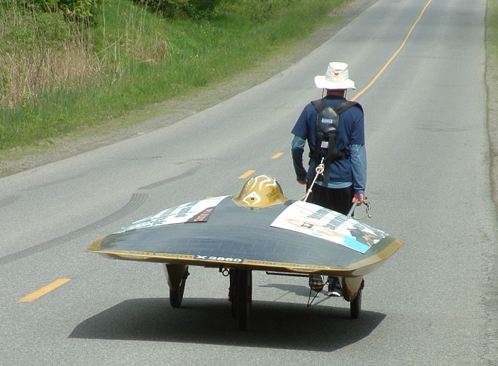 Marcelo pulling away with solar car behind